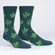 Green socks with marijuana leaf design on a white background