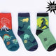 Set of Three glow-in-the-dark dinosaur-themed socks on a white background