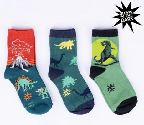 Set of Three glow-in-the-dark dinosaur-themed socks on a white background