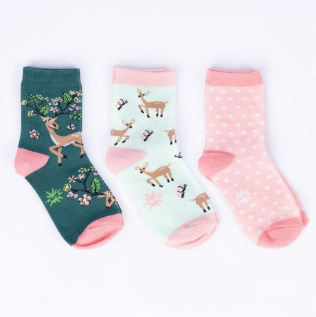 Three pairs of socks with deer and floral designs on a white background