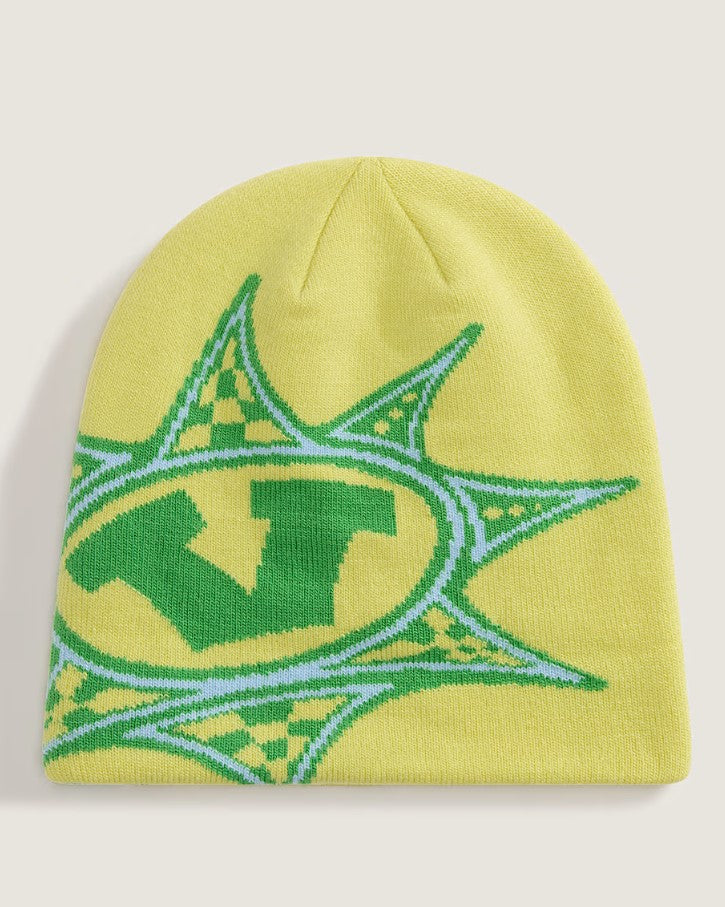Yellow beanie with green and blue pattern on a light gray background