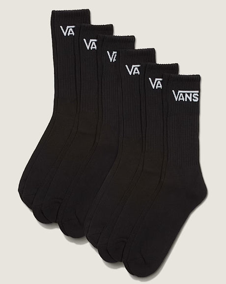 Set of six black socks with Vans logo on a light gray background