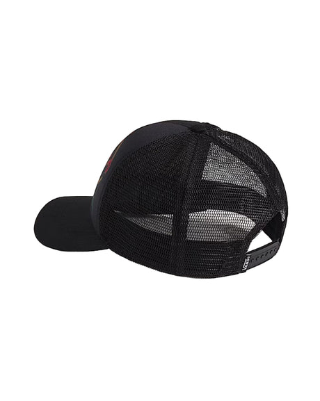 Black mesh cap on a light beige background