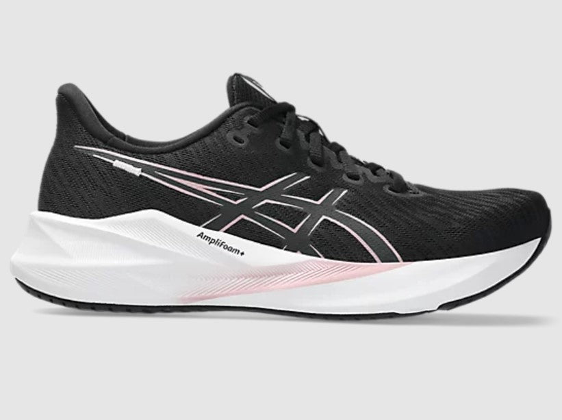 Black running shoe with white sole on a light gray background