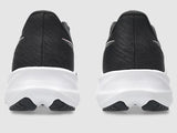 Black running shoes with white soles on a light gray background