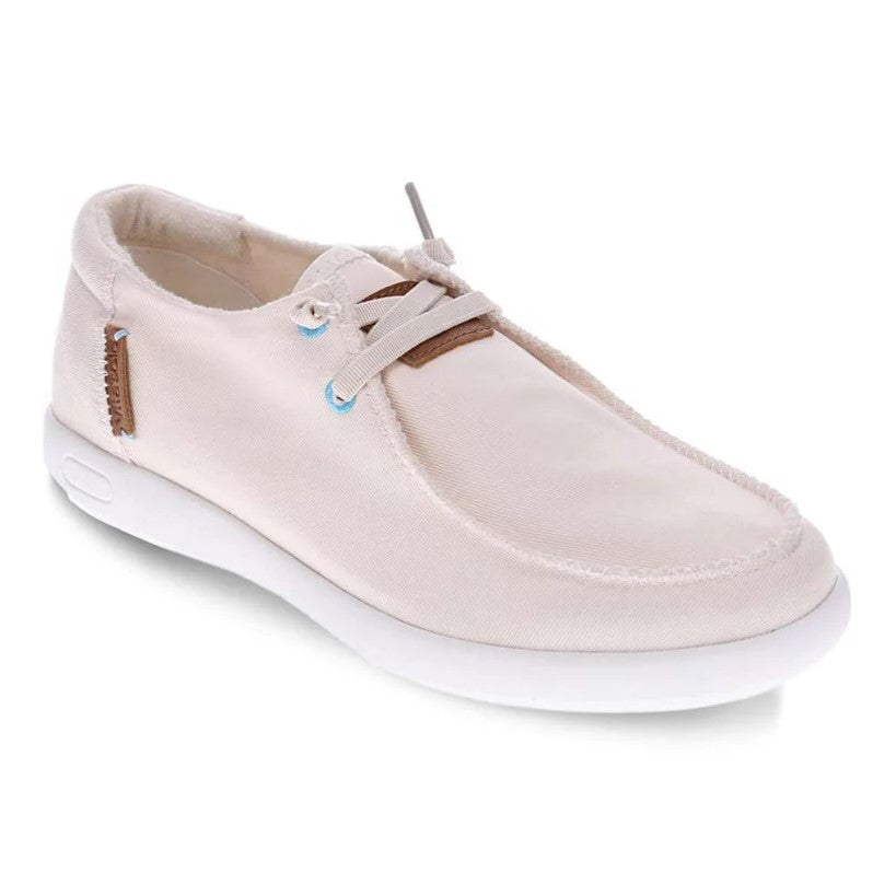 Beige casual shoe with white sole and slip on slip in laces on a white background